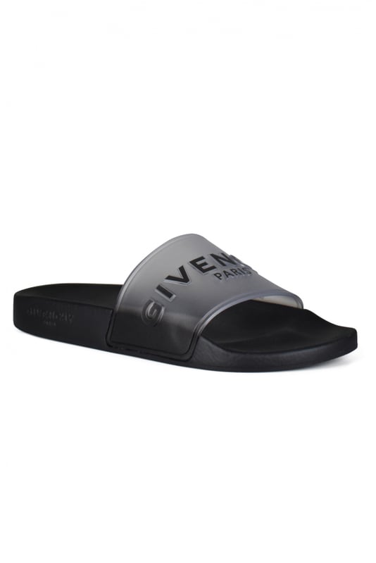 Chanclas negras Givenchy.Diseño translúcido. Logotipo negro impreso en la parte delantera.Suela plana de caucho.Made in Italy.