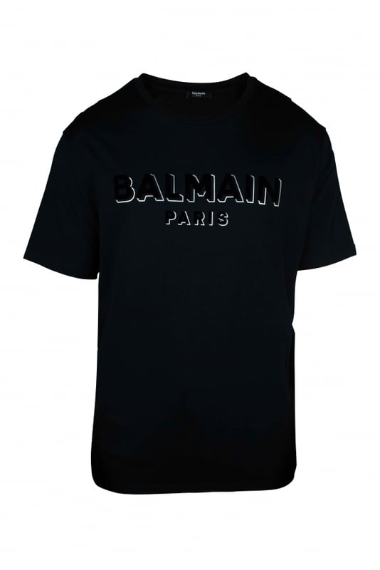 Balmain T-shirt Zwart Oversized zwart T-shirt van Balmain.Getextureerd logo op de voorkant met witte details.Korte mouwen. Ronde kraag.100% katoen.Gemaakt in Italië.
