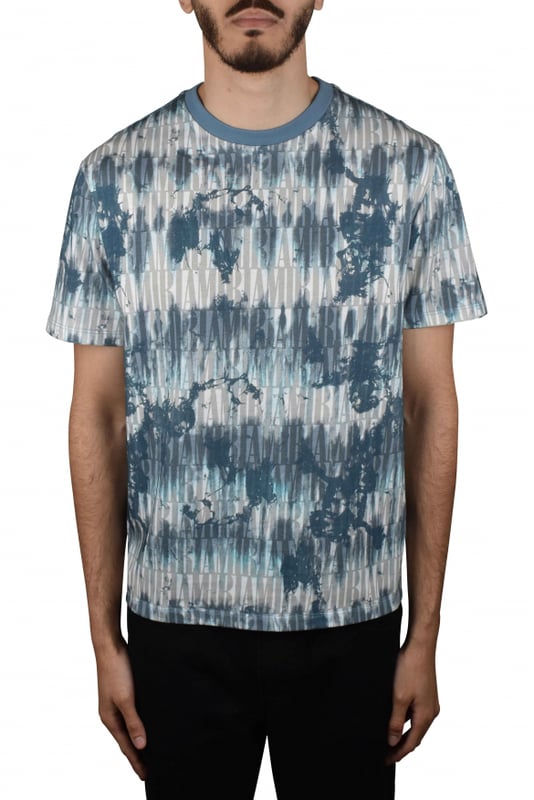 Amiri T-shirt van katoen met blauwe en witte tie-and-dye print.Tone-on-tone monogramlogo overal.Korte mouwen.Ronde kraag.Gemaakt in Italië.