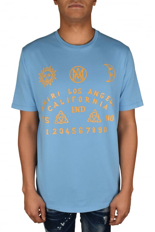 Camiseta azul claro Amiri.Estampados gráficos amarillos en la parte delantera.Manga corta.Cuello redondo.