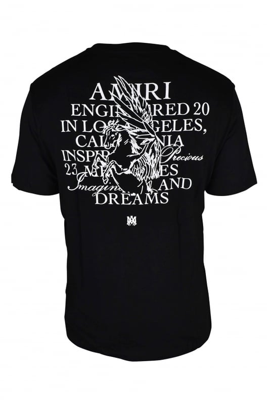Camiseta Amiri  Precious Memories  de algodón negro.Ilustración de un unicornio e inscripciones en blanco estampadas en el pecho.El mismo estampado en la espalda.Logotipo de la marca sobre el dibujo en la parte delantera y trasera.Cuello redondo.Mangas cortas.Made in Italy.