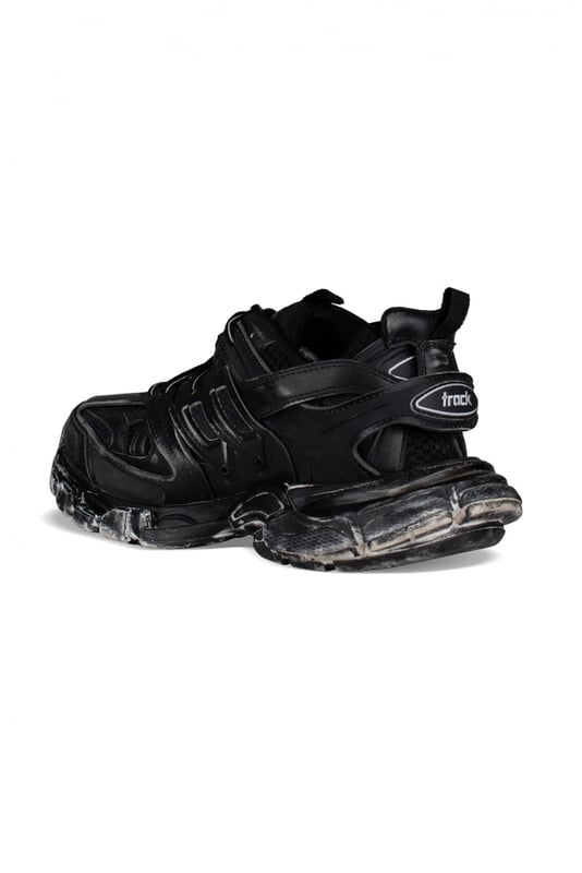 Sneakers negras Track Faded de Balenciaga.Efecto desgastado.Malla, nailon y polipiel.Talla inscrita en la puntera.Diseño con paneles.Inscripción Track en relieve en el contrafuerte.Logotipo Balenciaga impreso en el exterior en blanco.Doble cierre de cordones.Suela dinámica con refuerzo en la parte trasera.