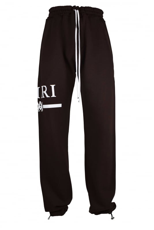 Pantalón de chándal Amiri de algodón marrón.Logotipo blanco estampado en una pernera.Cintura elástica con cordones blancos.Bolsillos laterales.Un bolsillo trasero.Tobillos elásticos con cordones.Made in Italy.