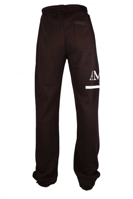 Pantalón de chándal Amiri de algodón marrón.Logotipo blanco estampado en una pernera.Cintura elástica con cordones blancos.Bolsillos laterales.Un bolsillo trasero.Tobillos elásticos con cordones.Made in Italy.