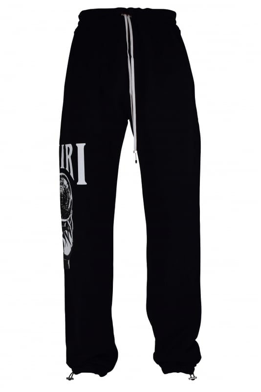Pantalón jogging Amiri de algodón negro.Estampado gráfico Crystal Ball blanco en una pernera.Cintura elástica con cordones blancos.Logotipo negro en la parte trasera.Bolsillos laterales.Un bolsillo trasero.Tobillos elásticos con cordones.Made in Italy.