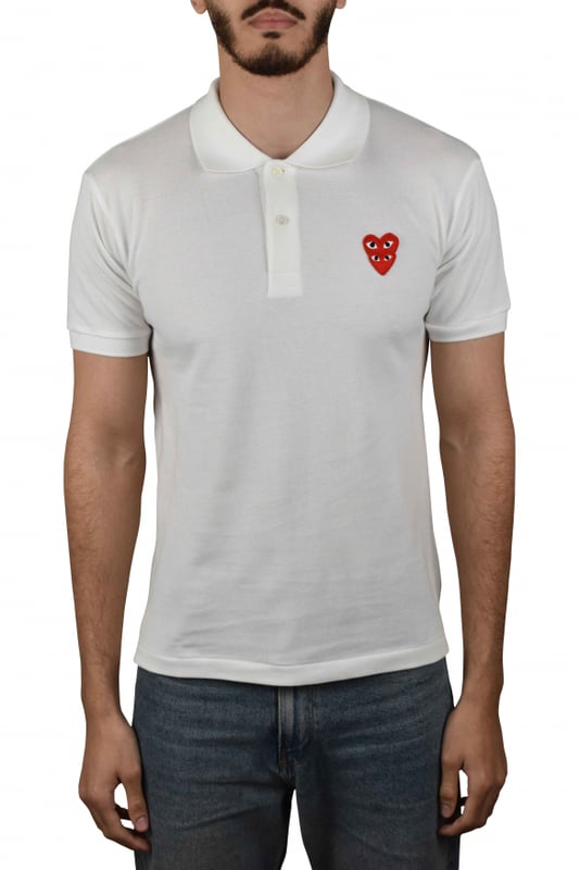 Comme des Garçons poloshirt van wit katoen.Bedrukt met twee emblematische rode harten op de borst.Korte mouwen.Klassieke button-down kraag.