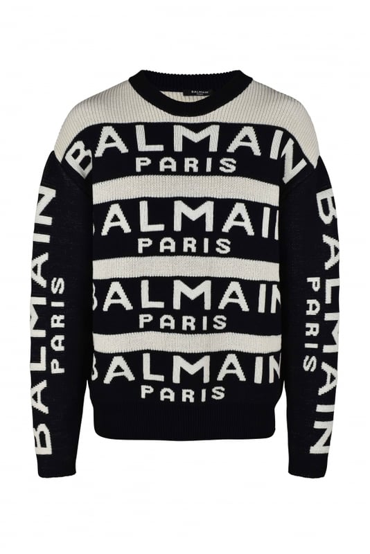 Jersey de lana blanco y negro de Balmain.Rayas negras con logotipo blanco.Mangas largas negras con logotipo blanco.Cuello redondo.Bordes de canalé.64% lana y 36% poliamida.Made in Italy.