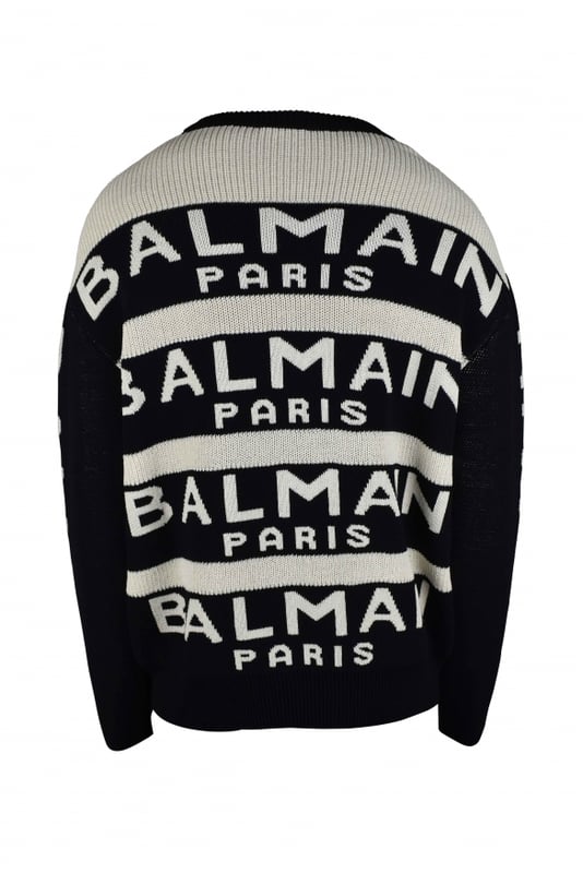 Jersey de lana blanco y negro de Balmain.Rayas negras con logotipo blanco.Mangas largas negras con logotipo blanco.Cuello redondo.Bordes de canalé.64% lana y 36% poliamida.Made in Italy.