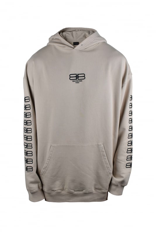 Sudadera con capucha de algodón beige de Balenciaga.  Logotipo BB negro bordado en el centro y a lo largo de las mangas.Bordes acanalados.Mangas largas. Bolsillo canguro.Corte oversize.