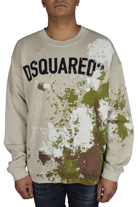 Sudadera Dsquared2 beige con manchas de pintura.Múltiples manchas de pintura de color caqui, marrón y blanco en la parte delantera y trasera.Logotipo negro  Dsquared2  en la parte delantera.Bolsillo tipo canguro en la parte delantera.Cuello redondo.100% algodón.Made in Italy.