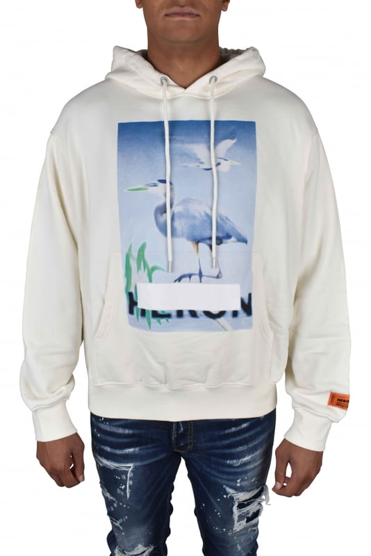 Sudadera con capucha Heron Preston Censored de algodón blanco.Estampado gráfico de pelícanos en blanco y azul.Parche con logotipo en la manga.Capucha con cordón.Bolsillo delantero tipo canguro.Mangas largas.Bordes de canalé.100% algodón.