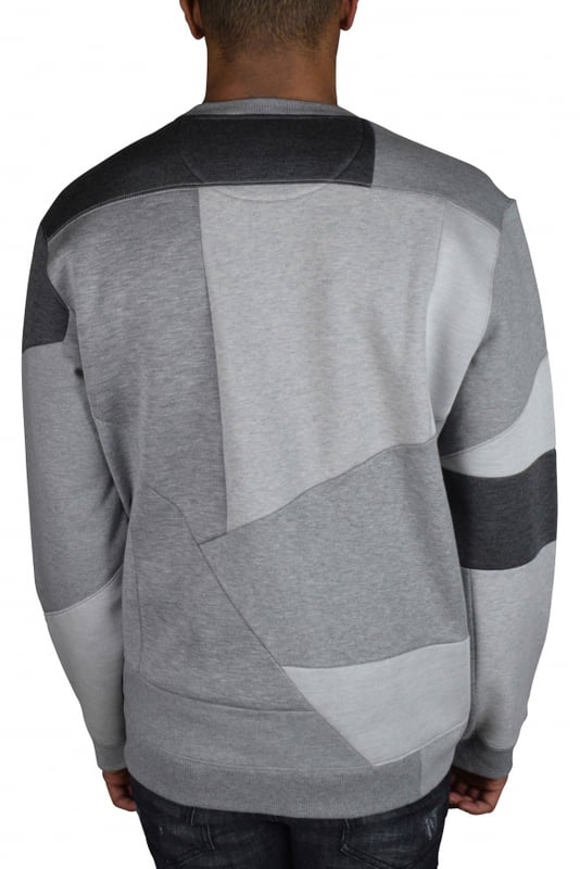 Valentino sweatshirt van grijs katoen.Lange mouwen met inzetstukken in verschillende grijstinten.VLTN-inscriptie in zwart op de borst.Ronde hals.Geribbelde randen.100% katoen.Gemaakt in Italië.