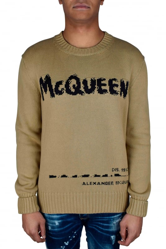 Jersey Alexander McQueen Graffiti beige.Firma McQueen Graffiti en intarsia negra en la parte delantera.Cuello redondo.Cuello, puños y bajo de canalé.Manga larga.Made in Italy.