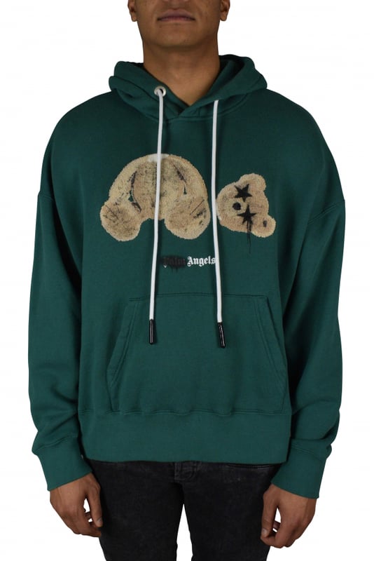 Sudadera Palm Angels en color verde abeto con osito de peluche con ojos de estrella.Con capucha y cordones con logotipo.Logotipo de Palm Angels en la parte delantera.Bolsillo tipo canguro en la parte delantera.Bordes acanalados.100% algodón.Made in Italy.