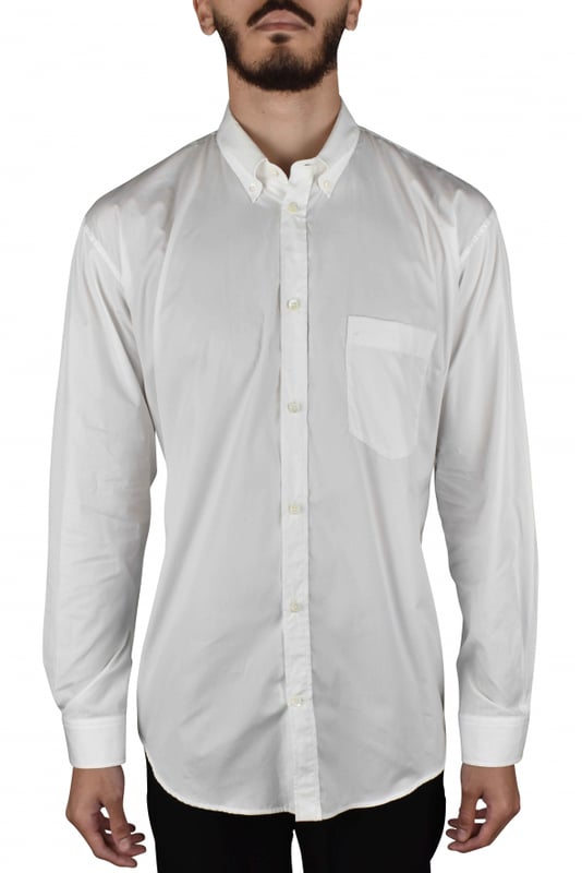 Camisa oversize Balenciaga de algodón blanco.Logotipo  BALENCIAGA  azul turquesa en la parte trasera de la camisa.Mangas largas.Bolsillo en el pecho.Cuello clásico.Cierre con botones blancos.100% algodón.