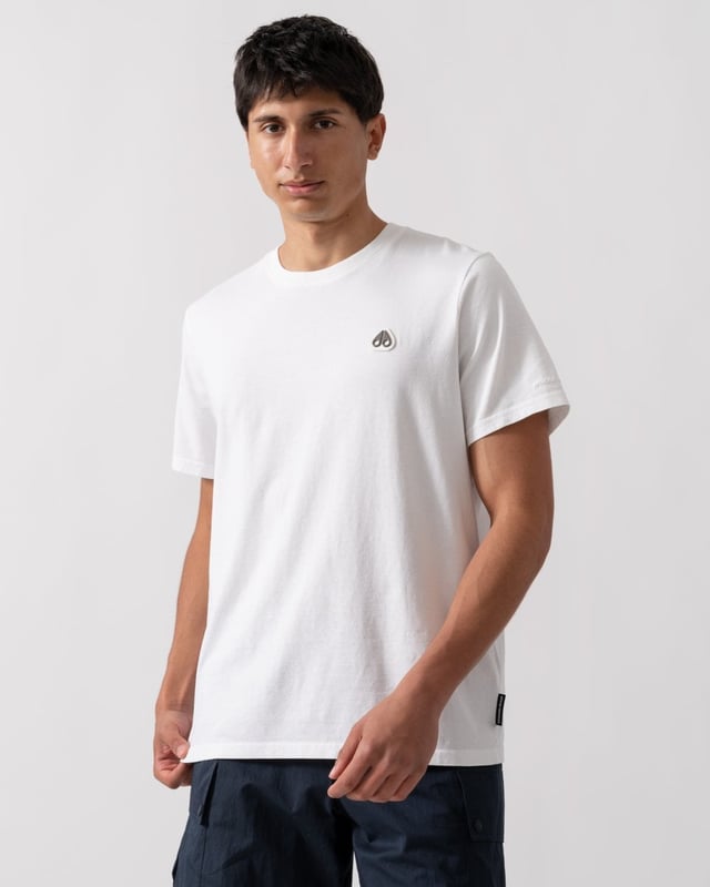 This t-shirt keeps it minimal with tiny branding at the front, offering a clean and understated look.


Regular Fit
Rib Knit Collar
Triangle Patch with Gun Metal Logo
Moose Knuckles Label on Side Seam



100% Pima Cotton Jersey
M15MT777