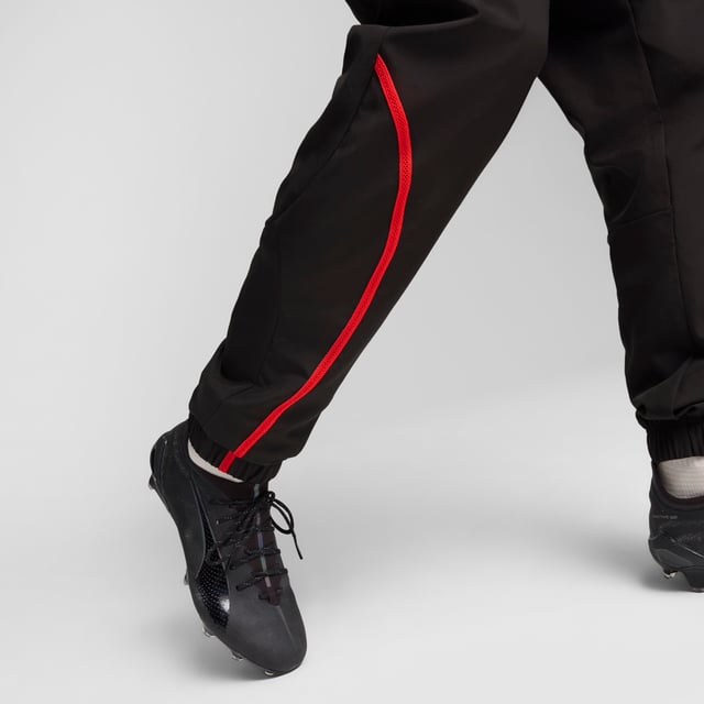 PRODUCT STORY: Show your Rossoneri pride with these official AC Milan pre-match woven pants. Constructed for comfort, these slim-fitting pants move with you while dryCELL tech wicks sweat and keeps you comfortable. Zipped pockets keep essentials secure as you focus on the match ahead. Forza Milan! FEATURES & BENEFITS: dryCELL: Performance technology designed to wick moisture from the body and keepyou free of sweat during exercise; Made with at least 50% recycled materials. DETAILS: Slim fit; 80 gsm, Plain weave; Medium rise; Zipped pockets; Official team branding.  Our model is 185 cm tall and is wearing size M UK.
