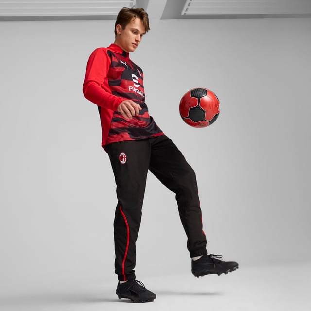 PRODUCT STORY: Show your Rossoneri pride with these official AC Milan pre-match woven pants. Constructed for comfort, these slim-fitting pants move with you while dryCELL tech wicks sweat and keeps you comfortable. Zipped pockets keep essentials secure as you focus on the match ahead. Forza Milan! FEATURES & BENEFITS: dryCELL: Performance technology designed to wick moisture from the body and keepyou free of sweat during exercise; Made with at least 50% recycled materials. DETAILS: Slim fit; 80 gsm, Plain weave; Medium rise; Zipped pockets; Official team branding.  Our model is 185 cm tall and is wearing size M UK.