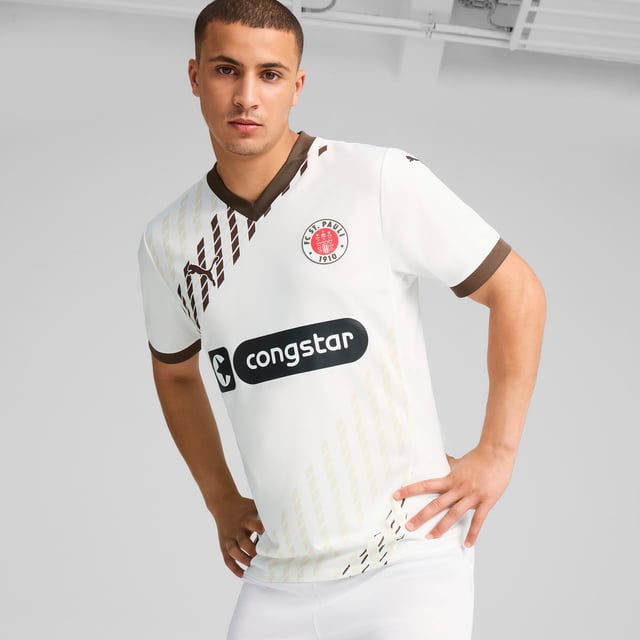 PUMA Mens FC St. Pauli 24/25 Away Jersey PRODUCT STORY: Gear up and show your allegiance to FC St. Pauli with the 24/25 Away Jersey. It features mesh inserts and moisture-wicking dryCELL tech to keep you feeling cool and comfortable. FEATURES & BENEFITS: dryCELL: Performance technology designed to wick moisture from the body and keep you free of sweat during exercise; As part of the RE:FIBRE program, this garment is made of at least 95% recycled material from textile waste and other used materials. DETAILS: Regular fit; 170 gsm, Jacquard; Mesh inserts; V-neck; Short sleeves; Official team branding; 100% Recycled Polyester. Our model is 189 cm tall and is wearing size M UK.