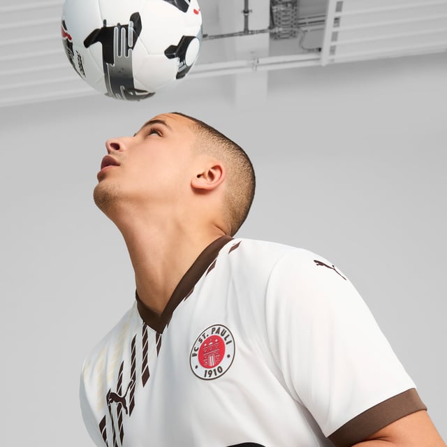 PUMA Mens FC St. Pauli 24/25 Away Jersey PRODUCT STORY: Gear up and show your allegiance to FC St. Pauli with the 24/25 Away Jersey. It features mesh inserts and moisture-wicking dryCELL tech to keep you feeling cool and comfortable. FEATURES & BENEFITS: dryCELL: Performance technology designed to wick moisture from the body and keep you free of sweat during exercise; As part of the RE:FIBRE program, this garment is made of at least 95% recycled material from textile waste and other used materials. DETAILS: Regular fit; 170 gsm, Jacquard; Mesh inserts; V-neck; Short sleeves; Official team branding; 100% Recycled Polyester. Our model is 189 cm tall and is wearing size M UK.