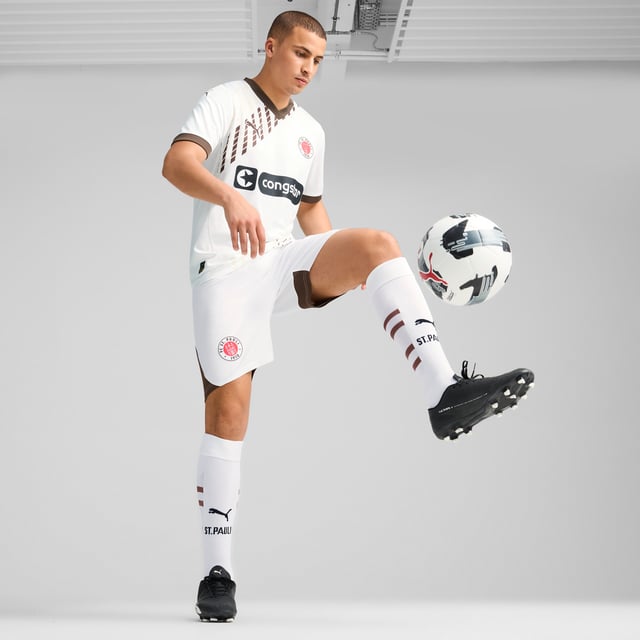 PUMA Mens FC St. Pauli 24/25 Away Jersey PRODUCT STORY: Gear up and show your allegiance to FC St. Pauli with the 24/25 Away Jersey. It features mesh inserts and moisture-wicking dryCELL tech to keep you feeling cool and comfortable. FEATURES & BENEFITS: dryCELL: Performance technology designed to wick moisture from the body and keep you free of sweat during exercise; As part of the RE:FIBRE program, this garment is made of at least 95% recycled material from textile waste and other used materials. DETAILS: Regular fit; 170 gsm, Jacquard; Mesh inserts; V-neck; Short sleeves; Official team branding; 100% Recycled Polyester. Our model is 189 cm tall and is wearing size M UK.
