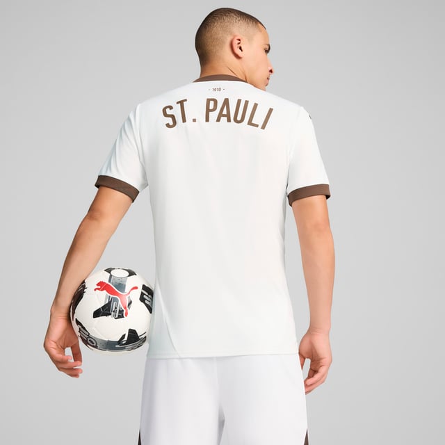 PUMA Mens FC St. Pauli 24/25 Away Jersey PRODUCT STORY: Gear up and show your allegiance to FC St. Pauli with the 24/25 Away Jersey. It features mesh inserts and moisture-wicking dryCELL tech to keep you feeling cool and comfortable. FEATURES & BENEFITS: dryCELL: Performance technology designed to wick moisture from the body and keep you free of sweat during exercise; As part of the RE:FIBRE program, this garment is made of at least 95% recycled material from textile waste and other used materials. DETAILS: Regular fit; 170 gsm, Jacquard; Mesh inserts; V-neck; Short sleeves; Official team branding; 100% Recycled Polyester. Our model is 189 cm tall and is wearing size M UK.
