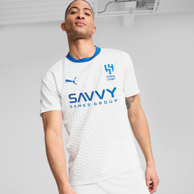 PRODUCT STORY: This official 24/25 Away Kit honours Al Hilal Saudi F.C. With a desert landscape graphic, reflecting the city of Riyadh. The club's badge stands proudly on the chest, while our moisture-wicking dryCELL fabric keeps you cool and dry.FEATURES &amp; BENEFITS: dryCELL: Performance technology designed to wick moisture from the body and keep you free of sweat during exercise; Made with 100% recycled material excluding trims &amp; decorations. DETAILS: Regular fit; 170 gsm, Jacquard; Crew neck; Short sleeves; Official team branding; 100% Recycled Polyester.
