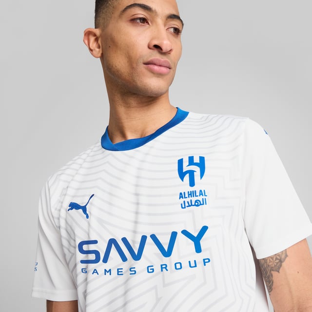 PRODUCT STORY: This official 24/25 Away Kit honours Al Hilal Saudi F.C. With a desert landscape graphic, reflecting the city of Riyadh. The club's badge stands proudly on the chest, while our moisture-wicking dryCELL fabric keeps you cool and dry.FEATURES &amp; BENEFITS: dryCELL: Performance technology designed to wick moisture from the body and keep you free of sweat during exercise; Made with 100% recycled material excluding trims &amp; decorations. DETAILS: Regular fit; 170 gsm, Jacquard; Crew neck; Short sleeves; Official team branding; 100% Recycled Polyester.