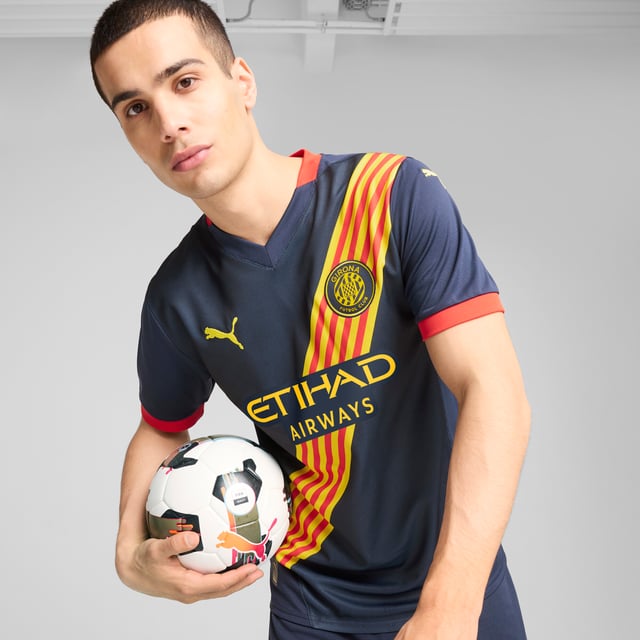 PRODUCT STORY: Gear up and show your allegiance to Girona FC with the official 24/25 Away Jersey. It features mesh panels and moisture-wicking dryCELL tech to keep you feeling cool and comfortable. FEATURES & BENEFITS: dryCELL: Performance technology designed to wick moisture from the body and keep you free of sweat during exercise; As part of the RE:FIBRE program, this garment is made of at least 95% recycled material from textile waste and other used materials. DETAILS: Regular fit; 170 gsm, Jacquard; Mesh inserts; V-neck; Short sleeves; Official team branding.  Our model is 183 cm tall and is wearing size M UK.