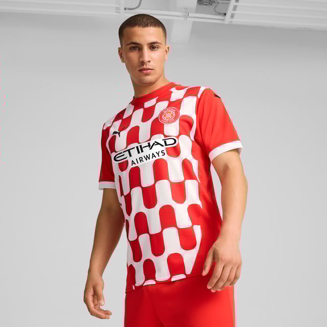 PRODUCT STORY: Gear up and show your allegiance to Girona FC with the official 24/25 Home Jersey. It features mesh panels and moisture-wicking dryCELL tech to keep you feeling cool and comfortable. FEATURES & BENEFITS: dryCELL: Performance technology designed to wick moisture from the body and keep you free of sweat during exercise; As part of the RE:FIBRE program, this garment is made of at least 95% recycled material from textile waste and other used materials. DETAILS: Regular fit; 170 gsm, Jacquard; Mesh inserts; Crew neck; Short sleeves; Official team branding.  Our model is 189 cm tall and is wearing size M UK.