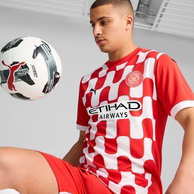 PRODUCT STORY: Gear up and show your allegiance to Girona FC with the official 24/25 Home Jersey. It features mesh panels and moisture-wicking dryCELL tech to keep you feeling cool and comfortable. FEATURES & BENEFITS: dryCELL: Performance technology designed to wick moisture from the body and keep you free of sweat during exercise; As part of the RE:FIBRE program, this garment is made of at least 95% recycled material from textile waste and other used materials. DETAILS: Regular fit; 170 gsm, Jacquard; Mesh inserts; Crew neck; Short sleeves; Official team branding.  Our model is 189 cm tall and is wearing size M UK.
