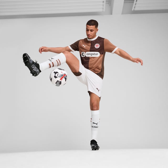 PRODUCT STORY: Gear up and show your allegiance to FC St. Pauli with the 24/25 Home Jersey. It features mesh inserts and moisture-wicking dryCELL tech to keep you feeling cool and comfortable. FEATURES & BENEFITS: dryCELL: Performance technology designed to wick moisture from the body and keep you free of sweat during exercise; As part of the RE:FIBRE program, this garment is made of at least 95% recycled material from textile waste and other used materials. DETAILS: Regular fit; 170 gsm, Jacquard; Mesh inserts; Crew neck; Short sleeves; Official team branding; 100% Recycled Polyester.  Our model is 189 cm tall and is wearing size M UK.