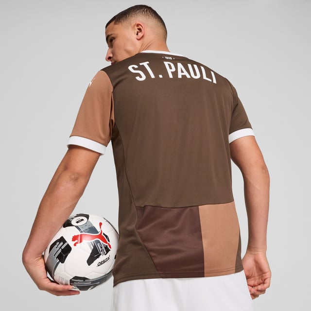 PRODUCT STORY: Gear up and show your allegiance to FC St. Pauli with the 24/25 Home Jersey. It features mesh inserts and moisture-wicking dryCELL tech to keep you feeling cool and comfortable. FEATURES & BENEFITS: dryCELL: Performance technology designed to wick moisture from the body and keep you free of sweat during exercise; As part of the RE:FIBRE program, this garment is made of at least 95% recycled material from textile waste and other used materials. DETAILS: Regular fit; 170 gsm, Jacquard; Mesh inserts; Crew neck; Short sleeves; Official team branding; 100% Recycled Polyester.  Our model is 189 cm tall and is wearing size M UK.