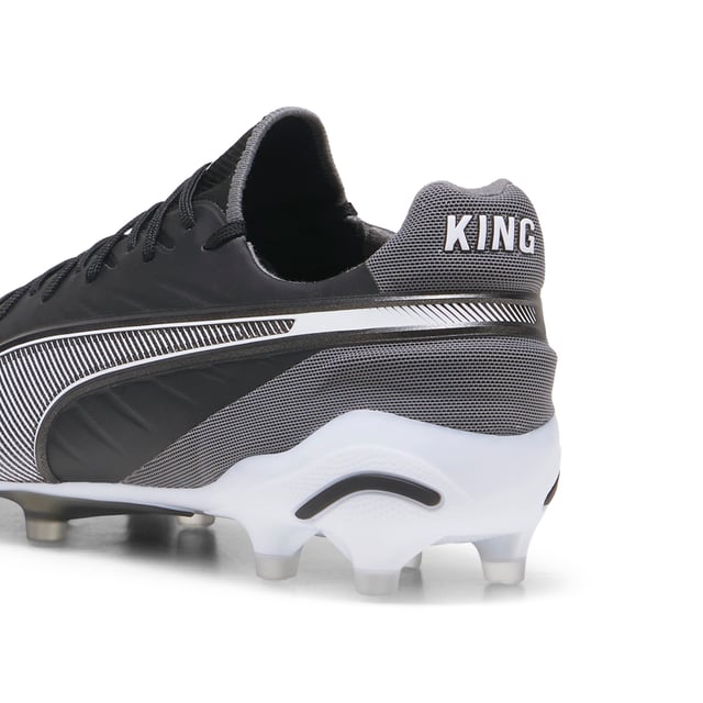 PUMA Unisex KING ULTIMATE FG/AG Football Boots PRODUCT STORY: Let everyone know: there’s a new KING in town. This football boot lives up to its name with the combination of non-animal-based K-BETTER™ upper material and GRIPCONTROL 3D structure on the medial side for enhanced ball control. A new KING doesn’t come along every day, but there will always be a new KING. The rightful heir is here. FEATURES & BENEFITS: TOUCH: Non-animal-based K-BETTER™ upper material for a new and improved take on the signature KING touch, comfort, and durability; CONTROL: GRIPCONTROL 3D rib structure on the medial side with grippy print for enhanced ball control; COMFORT: ORTHOLITE® memory foam padding in the heel for improved comfort; The upper of this shoe is made with at least 30% recycled materials. DETAILS: K-BETTER™ upper; Lightweight removable sockliner with NanoGrip technology to keep the foot from slipping inside the boot; OrthoLite® memory foam padding in the heel for improved comfort; Lightweight outsole with external heel counter, integrated stability spine, and conical studs for maximum manoeuvrability; Regular fit; Knitted low-cut slip-on construction ensures a comfortable fit; FG/AG: Suitable for use on firm or artificial surfaces; 84.66% Synthetic, 15.34% Textile.