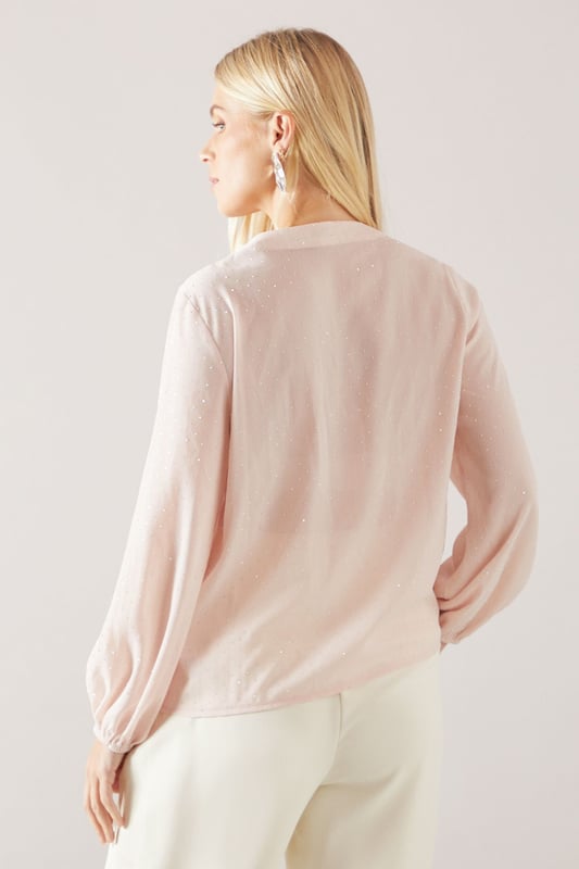 Elegant V-neckline with cascading ruffle front detail for a sophisticated finish
        Long sleeves with gentle elasticated cuffs for a graceful silhouette
        Lightweight woven fabric with delicate sheen perfect for special occasions
        Petite fit designed specifically for smaller frames with proportionate length
        Subtle button fastening detail enhancing the feminine aesthetic
    
    This Wallis Petite Occasion Hotfix Ruffle Front Blouse brings glamour to your formal wardrobe with its flowing cascading ruffle detail. The elegant V-neckline frames the dcolletage beautifully, while the long sleeves create a balanced silhouette. Style with wide-leg trousers as shown for a contemporary take on occasion dressing, or pair with a tailored pencil skirt for a more traditional ensemble. Perfect for weddings, race days and graduations, this blouse transitions effortlessly from day to evening events. Add statement earrings and a clutch bag to complete your sophisticated look. The petite proportions ensure a flattering fit without overwhelming smaller frames, making this a versatile piece that will become a cornerstone of your special occasion collection.