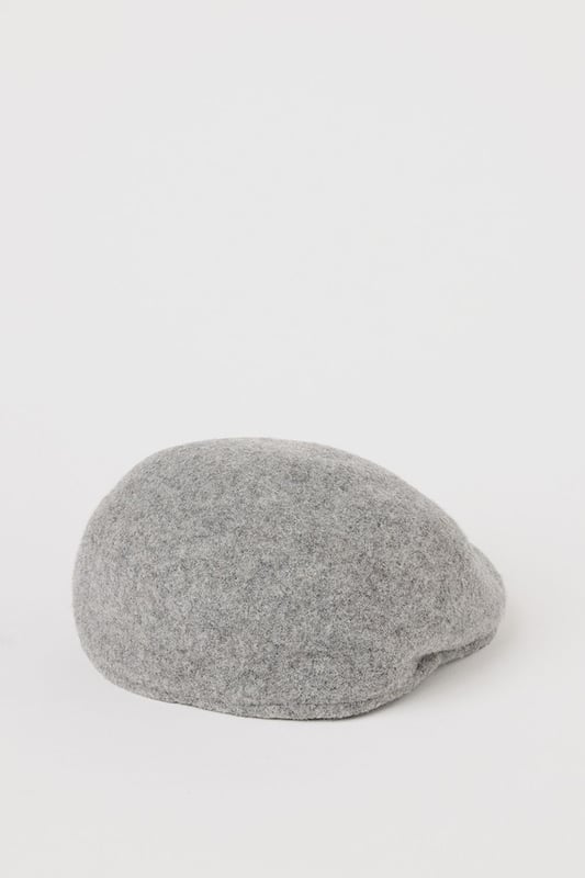 Crafted with wool for exceptional warmth and comfort
        Brushed texture adds subtle sophistication to the classic flat cap design
        Streamlined silhouette with a structured shape that maintains its form
        Versatile one-size design suitable for everyday wear
        Discreet side vent detail for improved fit and comfort
    
    This timeless flat cap from Burton brings traditional British style to your casual wardrobe. The brushed finish creates a refined texture that pairs brilliantly with autumn and winter outfits. Style with a classic button-up shirt and chinos for weekend pub lunches, or throw on with a casual jumper and jeans for sporting events. The neutral grey tone makes this cap exceptionally versatile, complementing both country walks and city outings with equal measure. For cooler days, layer with a wool overcoat and Chelsea boots for a distinguished look that balances comfort and style. This flat cap offers that perfect finishing touch to elevate your casual ensembles without appearing overly formal - an essential accessory for the modern British gent who appreciates heritage-inspired fashion.