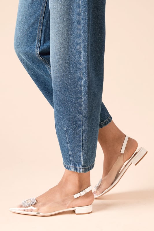 Elegant slingback flats featuring a striking decorative brooch detail on the pointed toe
        Comfortable flat heel measuring between 0-2cm for all-day wearability
        Adjustable slingback strap with buckle fastening for a secure, customised fit
        Pointed toe silhouette adds a touch of sophistication to casual and formal outfits
        Vinyl upper with leather detailing creates a contemporary, polished finish
    
    The Bess Slingback Flats from Dorothy Perkins combine practicality with refined style for the modern woman. The standout brooch embellishment transforms these flats from simple to statement-making, whilst the pointed toe and slingback design offer a flattering silhouette. Style with cropped denim and a crisp blouse for weekend brunches with friends, or pair with tailored trousers and a blouse for office-appropriate sophistication. For special occasions, these versatile flats complement midi dresses and skirts beautifully, providing comfort without compromising on elegance. The neutral styling makes them perfect for baby showers and afternoon teas, where you want to look put-together whilst remaining comfortable throughout the event. These flats strike the perfect balance between trend-conscious design and timeless appeal - a wardrobe essential for the woman who values both style and comfort.