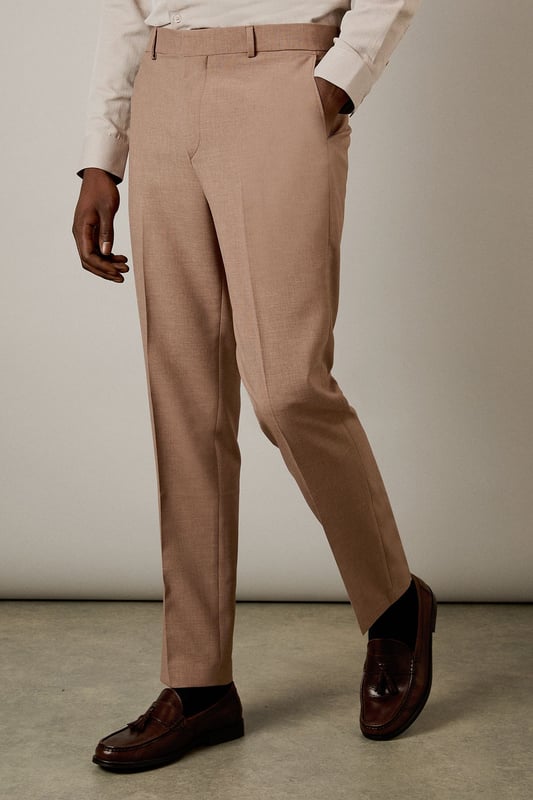 Slim fit design with a contemporary tapered leg for a refined silhouette
        Textured woven fabric adds subtle depth and visual interest
        Clean front with belt loops and side pockets for practicality
        Back pockets with button closure for secure storage
        Crisp centre crease for a sharp, professional finish
    
    These textured slim fit trousers from Burton deliver sophisticated style with modern appeal. The tailored silhouette creates a sleek profile that flatters without restricting movement-perfect for the gentleman who appreciates classic styling with contemporary proportions. Pair with the matching jacket as seen on our model for a complete suit that works brilliantly for formal occasions, or dress down with a crisp Oxford shirt for smart-casual events. The versatile trousers transition effortlessly from office meetings to evening drinks at your local. For a polished weekend look, team with a quality knitted jumper and leather loafers. These trousers offer the perfect balance of comfort and style for the man who values both tradition and contemporary fashion sensibilities.