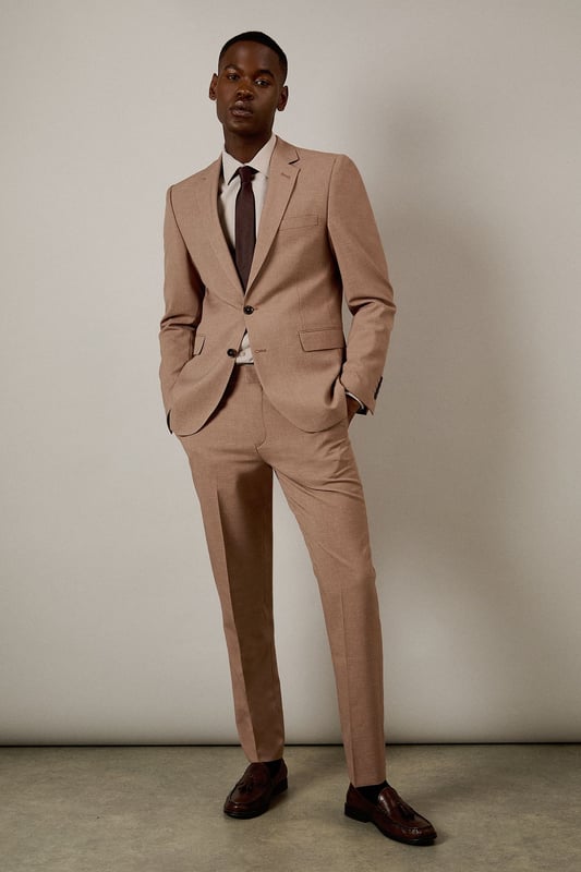Slim fit design with a contemporary tapered leg for a refined silhouette
        Textured woven fabric adds subtle depth and visual interest
        Clean front with belt loops and side pockets for practicality
        Back pockets with button closure for secure storage
        Crisp centre crease for a sharp, professional finish
    
    These textured slim fit trousers from Burton deliver sophisticated style with modern appeal. The tailored silhouette creates a sleek profile that flatters without restricting movement-perfect for the gentleman who appreciates classic styling with contemporary proportions. Pair with the matching jacket as seen on our model for a complete suit that works brilliantly for formal occasions, or dress down with a crisp Oxford shirt for smart-casual events. The versatile trousers transition effortlessly from office meetings to evening drinks at your local. For a polished weekend look, team with a quality knitted jumper and leather loafers. These trousers offer the perfect balance of comfort and style for the man who values both tradition and contemporary fashion sensibilities.