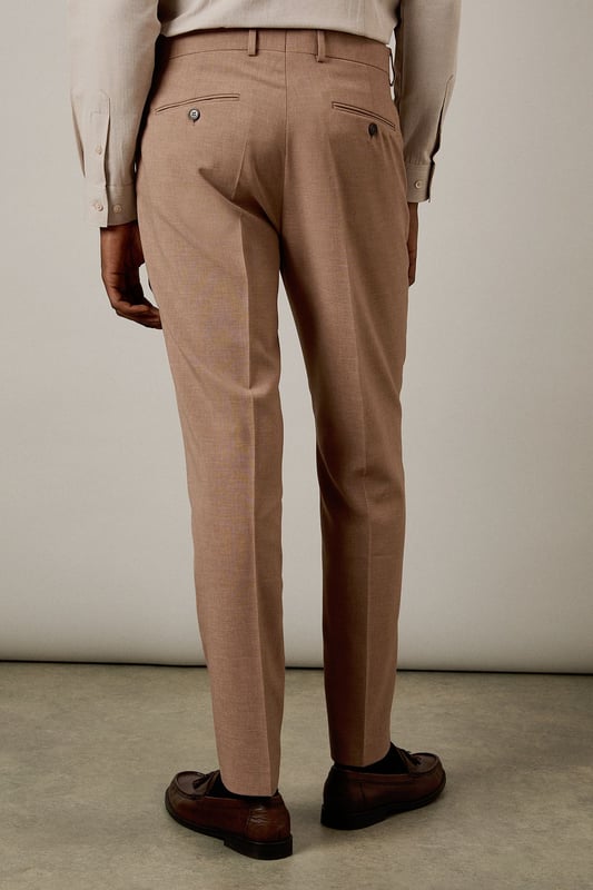 Slim fit design with a contemporary tapered leg for a refined silhouette
        Textured woven fabric adds subtle depth and visual interest
        Clean front with belt loops and side pockets for practicality
        Back pockets with button closure for secure storage
        Crisp centre crease for a sharp, professional finish
    
    These textured slim fit trousers from Burton deliver sophisticated style with modern appeal. The tailored silhouette creates a sleek profile that flatters without restricting movement-perfect for the gentleman who appreciates classic styling with contemporary proportions. Pair with the matching jacket as seen on our model for a complete suit that works brilliantly for formal occasions, or dress down with a crisp Oxford shirt for smart-casual events. The versatile trousers transition effortlessly from office meetings to evening drinks at your local. For a polished weekend look, team with a quality knitted jumper and leather loafers. These trousers offer the perfect balance of comfort and style for the man who values both tradition and contemporary fashion sensibilities.