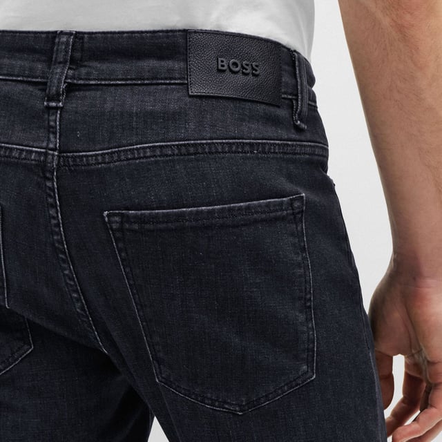 Regular-rise jeans cut to a slim fit with a straight leg in black Italian denim with a cashmere-like softness by BOSS Menswear. Fit: Slim fitBottom standard closure: Zip closureFit foot width: 35.4 cmFit rise: Regular riseFit length: Standard lengthOccasions: LeisureOccasions: WeekendOccasions: DayPockets bottom back: Patch pocketPockets bottom front: Side pocketsFit leg shape: Straight legFit: Slim fitBottom standard closure: Zip closureFit foot width: 35.4 cmFit rise: Regular riseFit length: Standard lengthOccasions: LeisureOccasions: WeekendOccasions: DayPockets bottom back: Patch pocketPockets bottom front: Side pocketsFit leg shape: Straight leg92% Cotton2% Elastane6% Elastomultiester