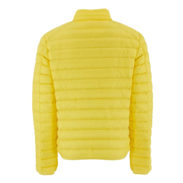 Mens JOTT Mat Lightweight Puffer Jacket in yellow gold.Thin and light  the men down jacket MAT will protect you from wind and cold thanks to its feather and down padding. This long sleeves jacket has 2 invisible zipped pockets and a front zip closure. Thermal insulation: light- Water repellent- Responsible down- Main material: 100% Polyamide.  Lining: 100% Polyamide.  Filling: 90% Down  10% Feather.- Ref: PF23MDOW02-629