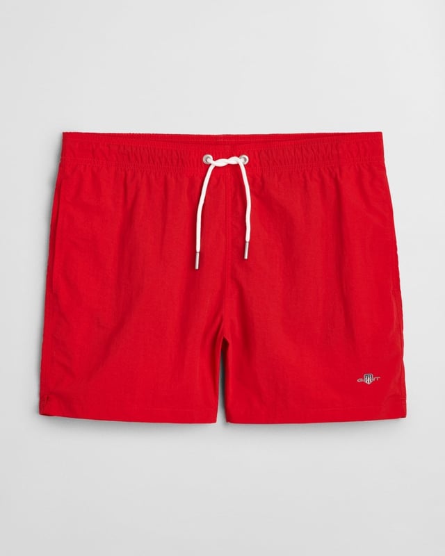 Crafted from 100% recycled polyamide, these GANT swim shorts are the perfect essential for the summer season. Cut for a regular fit, they have a mid-thigh length and a regular waist. They feature an embroidered GANT shield graphic on the left leg, side seam pockets, a single back pocket, and an elasticated drawstring waistband. 

Regular fit
Mid-thigh length
Regular waist
GANT graphic embroidered on left leg

 100% Recycled Polyamide 

920016000
 
 