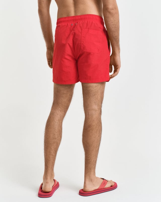 Crafted from 100% recycled polyamide, these GANT swim shorts are the perfect essential for the summer season. Cut for a regular fit, they have a mid-thigh length and a regular waist. They feature an embroidered GANT shield graphic on the left leg, side seam pockets, a single back pocket, and an elasticated drawstring waistband. 

Regular fit
Mid-thigh length
Regular waist
GANT graphic embroidered on left leg

 100% Recycled Polyamide 

920016000
 
 