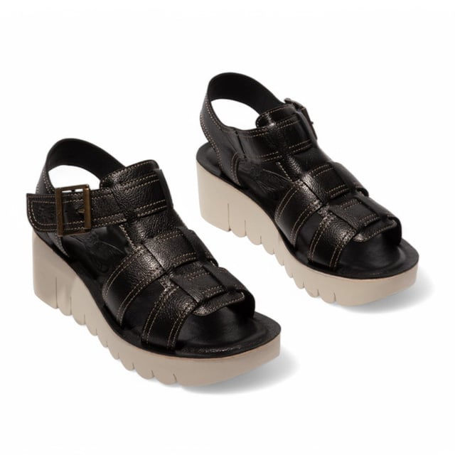 Part of the Yolo Line, the YUDD236FLY sandals combine contemporary style with all-day comfort. Featuring a smooth leather upper, cushioned insole, and secure Velcro fastening, these wedges offer a perfect balance of fashion and functionality.

Key Features:
Premium leather upper – Sleek and durable design.
Soft microfiber lining – Ensures breathability and comfort.
Leather insole – Provides added cushioning and support.
Adjustable Buckled Velcro strap – Easy to wear and adjust for a perfect fit.
TR rubber wedge sole – Enhances grip and stability.
6cm wedge heel – Adds height while maintaining comfort.
A stylish choice for effortless elegance and everyday wear!