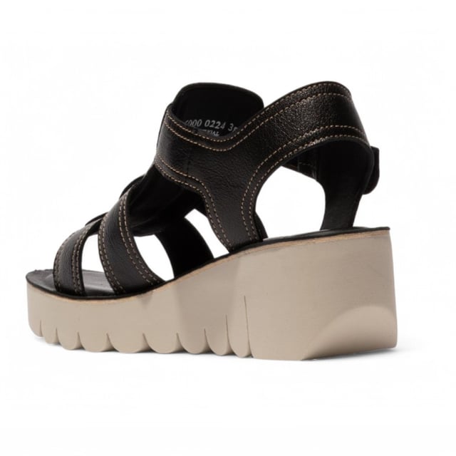 Part of the Yolo Line, the YUDD236FLY sandals combine contemporary style with all-day comfort. Featuring a smooth leather upper, cushioned insole, and secure Velcro fastening, these wedges offer a perfect balance of fashion and functionality.

Key Features:
Premium leather upper – Sleek and durable design.
Soft microfiber lining – Ensures breathability and comfort.
Leather insole – Provides added cushioning and support.
Adjustable Buckled Velcro strap – Easy to wear and adjust for a perfect fit.
TR rubber wedge sole – Enhances grip and stability.
6cm wedge heel – Adds height while maintaining comfort.
A stylish choice for effortless elegance and everyday wear!