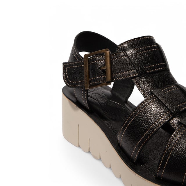 Part of the Yolo Line, the YUDD236FLY sandals combine contemporary style with all-day comfort. Featuring a smooth leather upper, cushioned insole, and secure Velcro fastening, these wedges offer a perfect balance of fashion and functionality.

Key Features:
Premium leather upper – Sleek and durable design.
Soft microfiber lining – Ensures breathability and comfort.
Leather insole – Provides added cushioning and support.
Adjustable Buckled Velcro strap – Easy to wear and adjust for a perfect fit.
TR rubber wedge sole – Enhances grip and stability.
6cm wedge heel – Adds height while maintaining comfort.
A stylish choice for effortless elegance and everyday wear!
