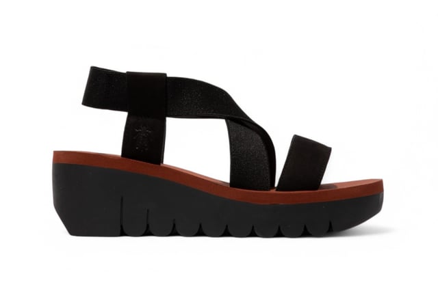 The YABI922FLY sandals from Fly London elevate your footwear collection with a sleek and modern design. Crafted with premium materials, these sandals feature an adjustable slingback and a sturdy wedge sole, offering both style and comfort. Whether you're dressing up for a casual day out or looking for a comfortable yet chic option for long hours, these sandals are a versatile choice that will keep you feeling confident all day long.

Key Features:

Premium Leather Upper: High-quality leather construction for long-lasting durability.
Microfiber Lining: Soft, abrasion-free lining for a smooth and comfortable fit.
EVA Footbed: Non-removable, cushioned footbed that provides excellent support and comfort.
Elastic Gussets: Flexible elastic panels offer a secure, customizable fit.
Wedge Sole: Stylish 6 cm wedge for added height and a trendy look.
Durable Rubber Outsole: Provides superior grip and traction for all-day wear.