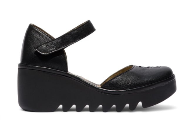 The BISO305FLY sandals from Fly London bring together timeless elegance and all-day comfort. Designed for effortless style, these sandals feature a high-quality leather upper, a comfortable leather-lined footbed, and a durable wedge sole. Whether you're walking through the city or relaxing on a sunny day, these sandals will elevate your look with their sophisticated design and reliable comfort.

Key Features:

Premium Leather Upper: High-quality, durable leather upper for a refined and elegant look.
Leather Lining: Soft leather lining provides a smooth, abrasion-free experience.
Leather Footbed: Non-removable footbed lined with leather for superior cushioning and support.
Easy Closure: Easy-to-use velcro strap ensures a secure, customized fit for added stability.
Wedge Sole: Stylish 6.5 cm wedge for enhanced height and a fashionable touch.
TR Rubber Outsole: Durable rubber sole designed for exceptional grip and traction.
Heel Height: 6.5 cm wedge heel adds the perfect amount of lift while keeping comfort in mind.