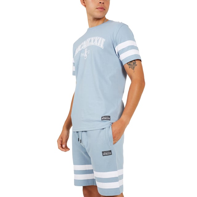 Update your casual wardrobe with this t-shirt and shorts set from Brave Soul. The crew neck t-shirt features cut and sew panel detail on the chest and sleeves and embroidery detail on the chest, and the matching shorts feature two side pockets and embroidery detail on the leg. This set boasts style and comfort for the perfect everyday outfit. Model wears UK size M.